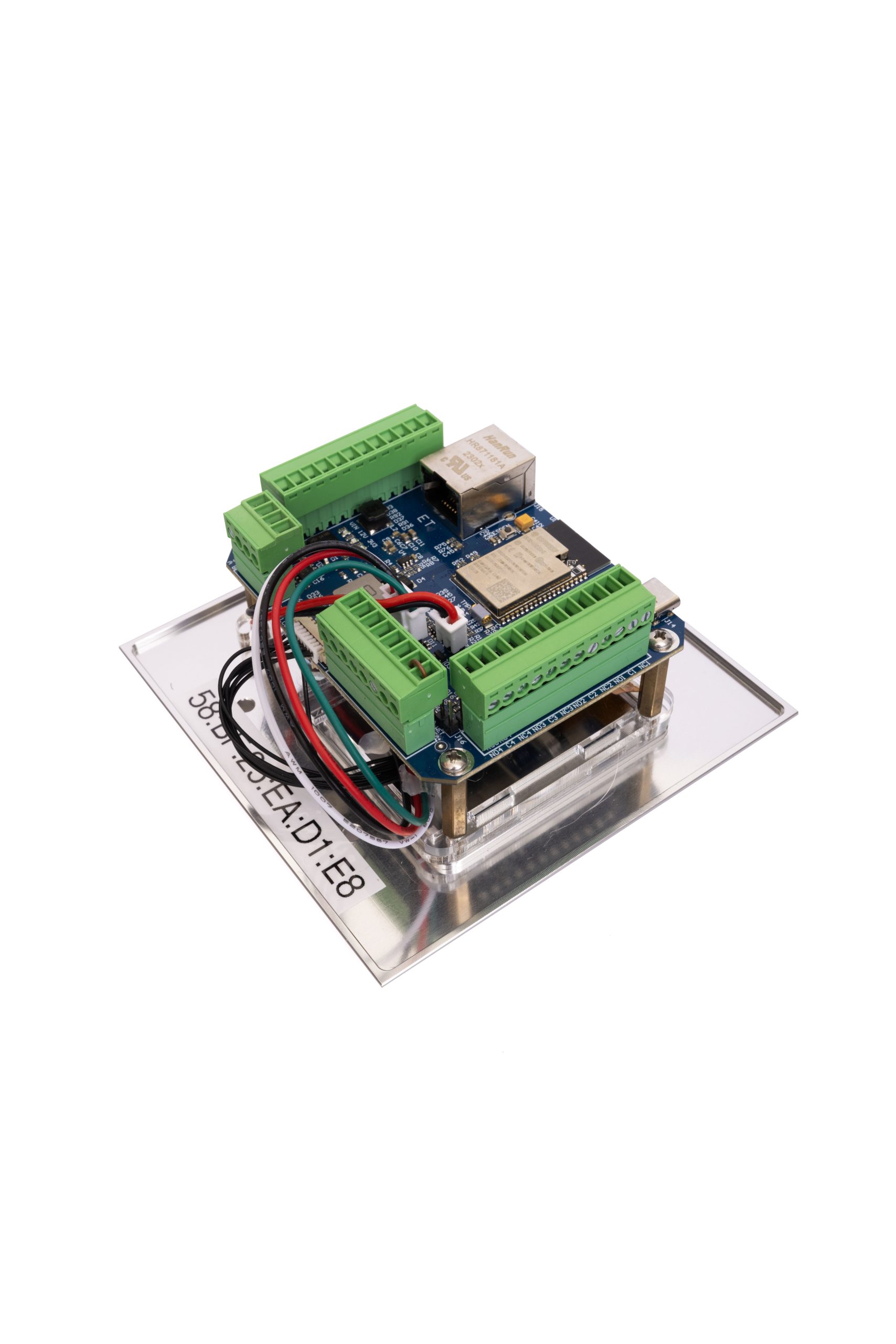 Side view of the iDMA9800 control board showing green terminal blocks and integrated Ethernet module.